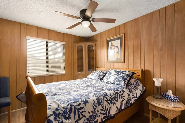 a bedroom with a bed and a table