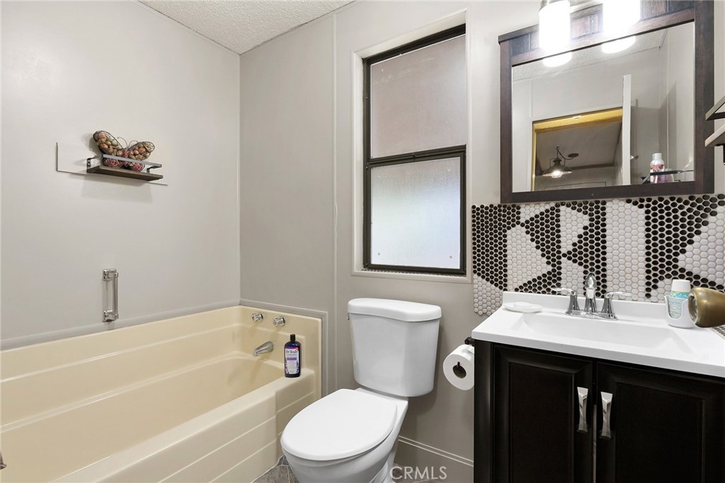 3835 Gardiner Ferry Road, Unit 2 Corning, CA 96021 - Photo 24 of 51 a bathroom with a toilet a sink and a bathtub