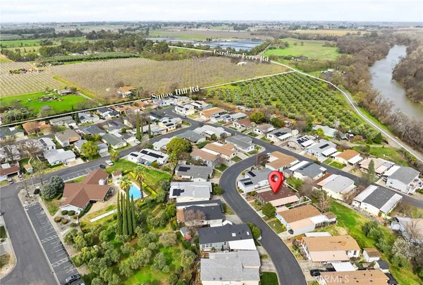 an aerial view of residential building and lake