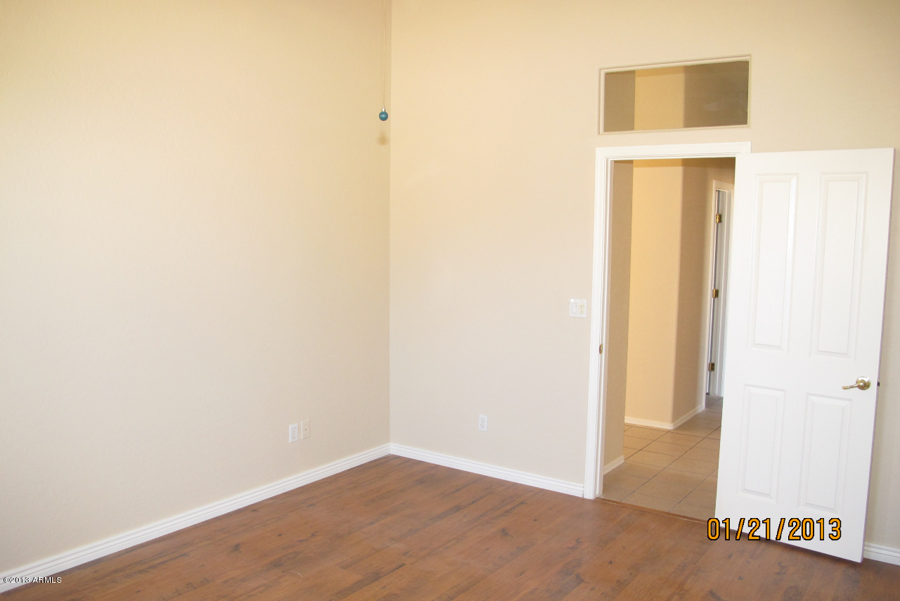 525 South Boyd Road Apache Junction, AZ 85119 - Photo 18 of 39 a view of a small space with wooden floor and a hallway