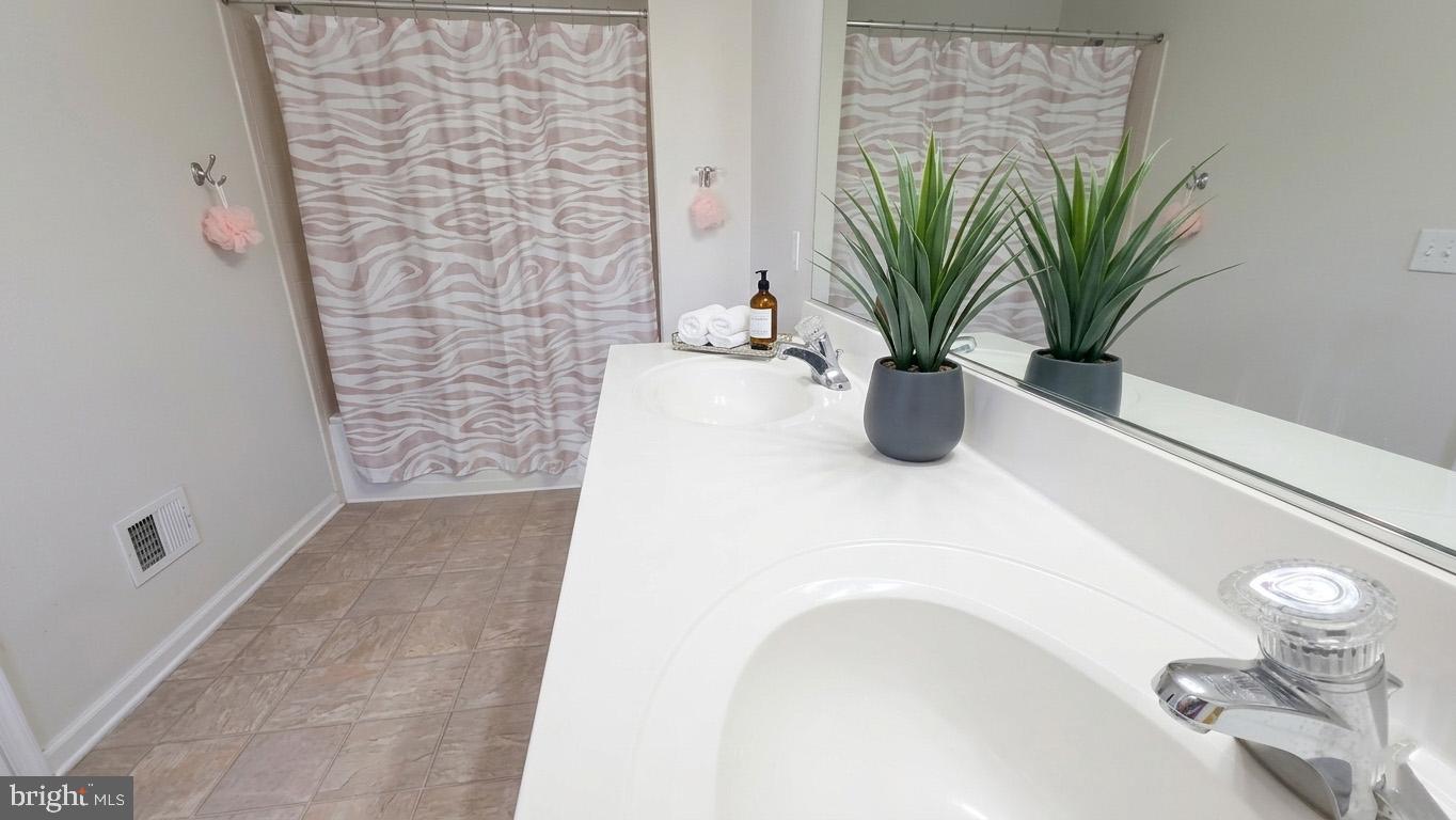 17143 Gibson Mill Road Dumfries, VA 22026 - Photo 6 of 35 Modern bathroom with stylish accents.