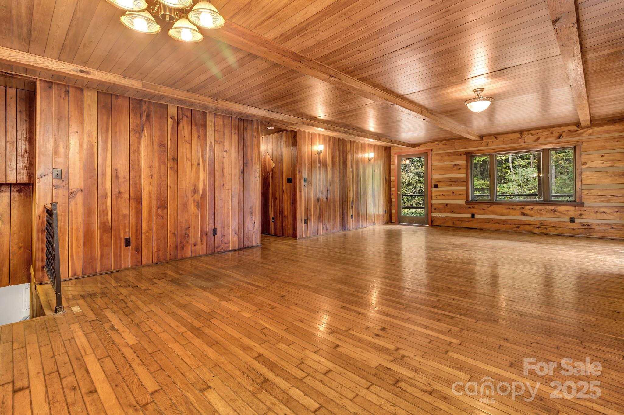 200 Dry Branch Road Marshall, NC 28753 - Photo 11 of 38 a view of an empty room with wooden floor