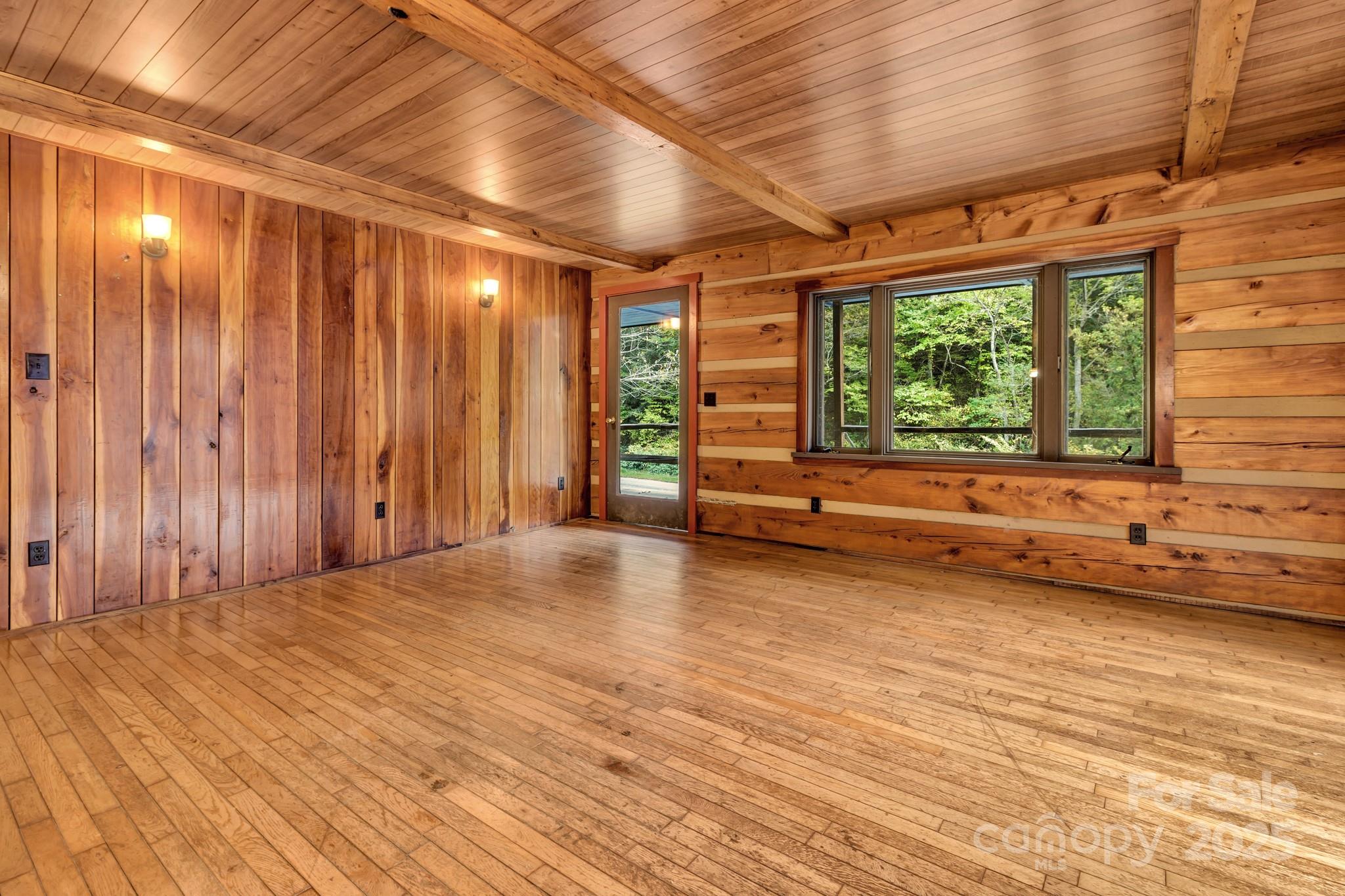 200 Dry Branch Road Marshall, NC 28753 - Photo 14 of 38 a view of a room with wooden walls and next to a window