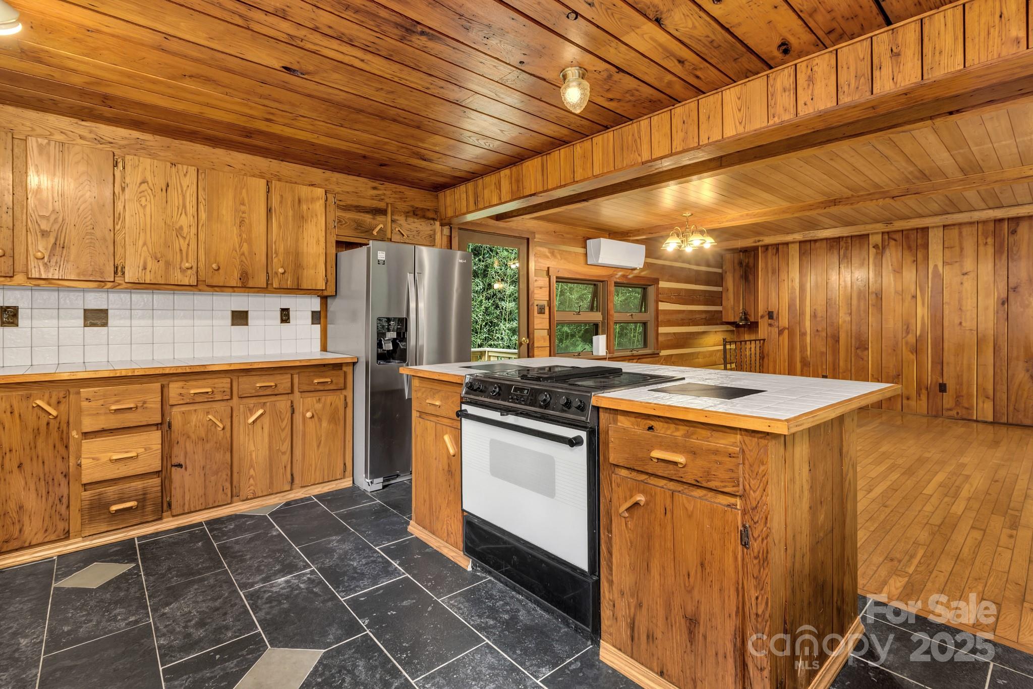 200 Dry Branch Road Marshall, NC 28753 - Photo 16 of 38 a kitchen with a stove sink and cabinets