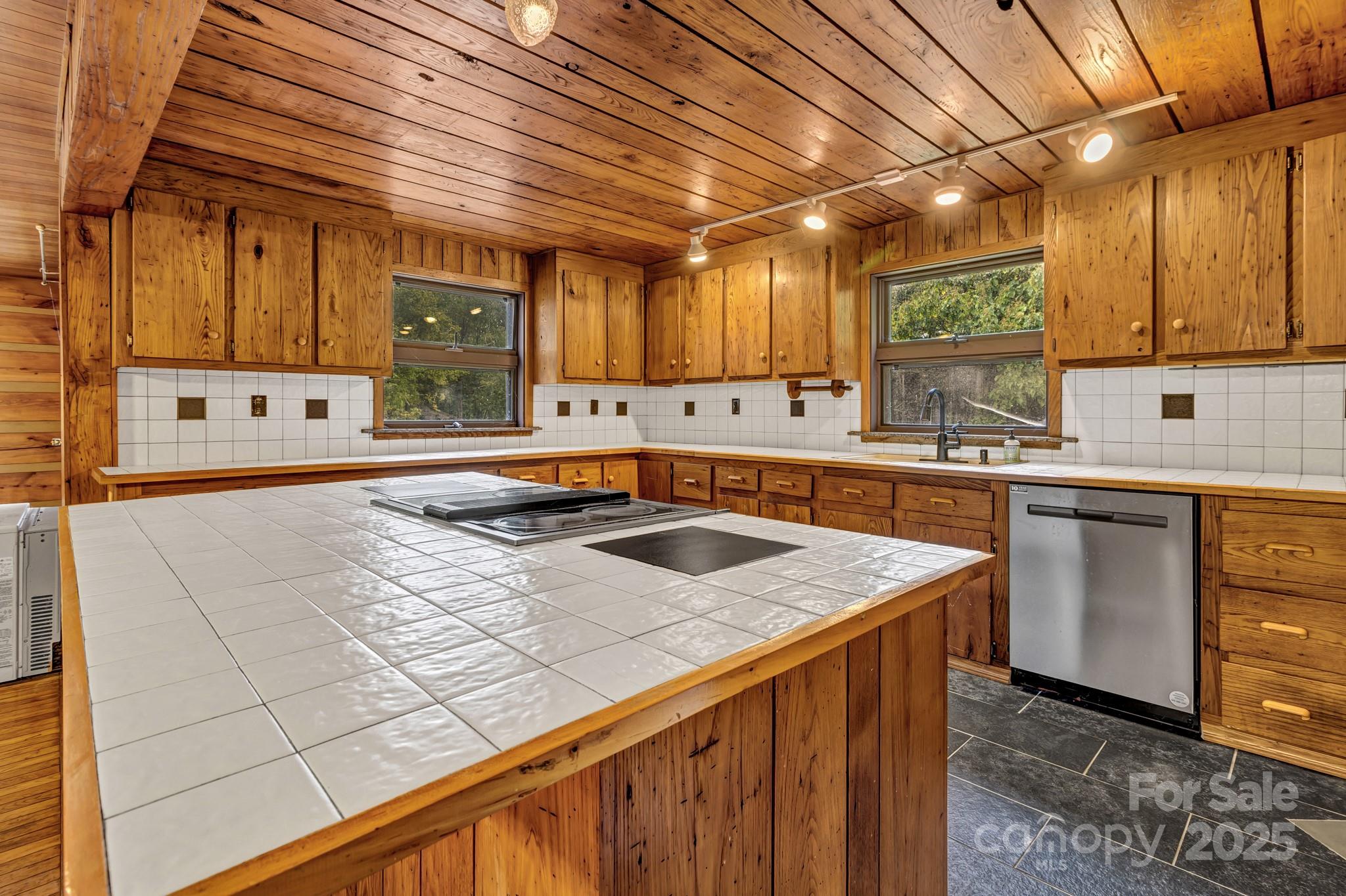 200 Dry Branch Road Marshall, NC 28753 - Photo 18 of 38 a kitchen with stainless steel appliances granite countertop a sink stove and cabinets