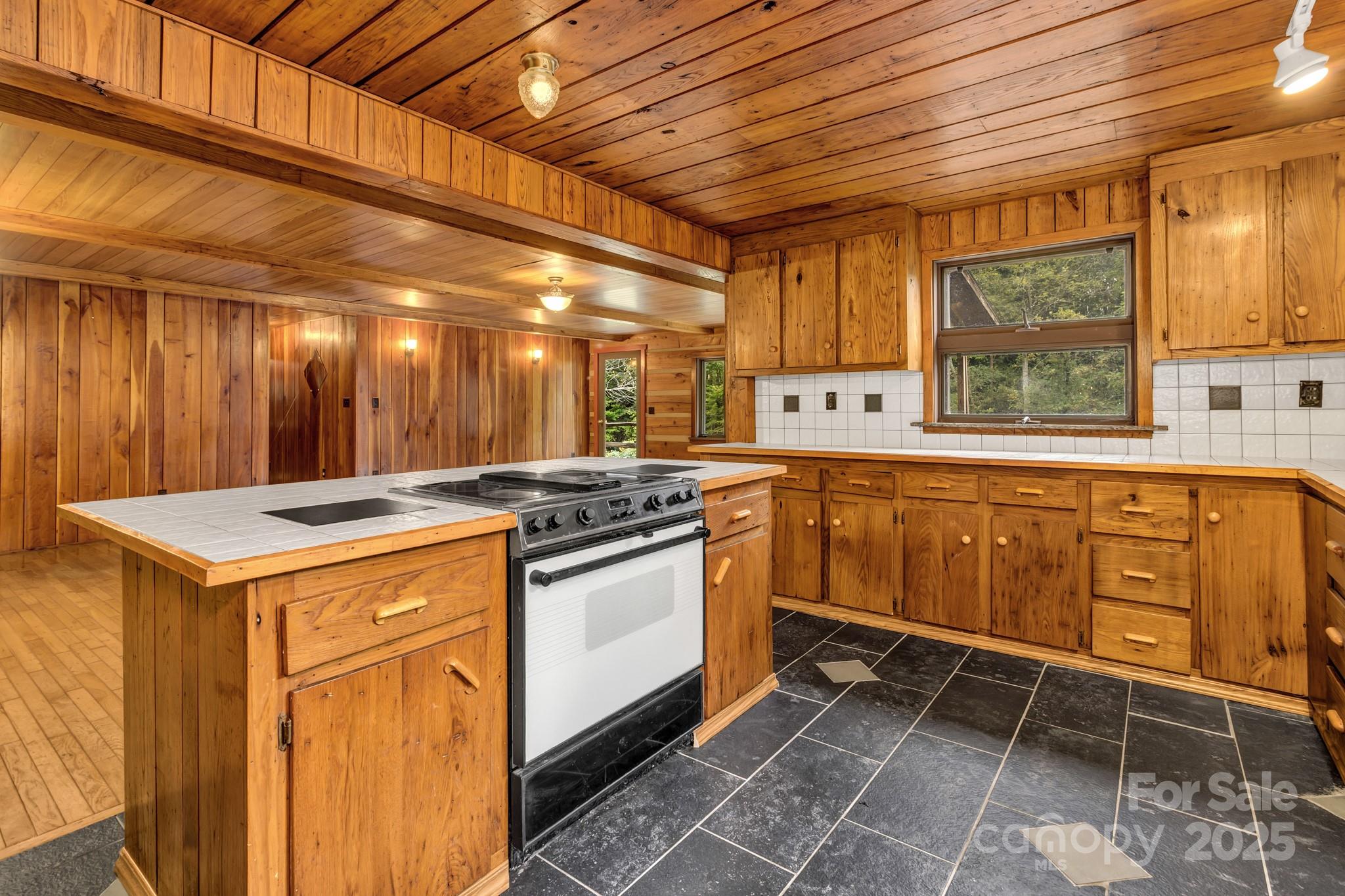 200 Dry Branch Road Marshall, NC 28753 - Photo 19 of 38 a kitchen that has a stove and a microwave oven