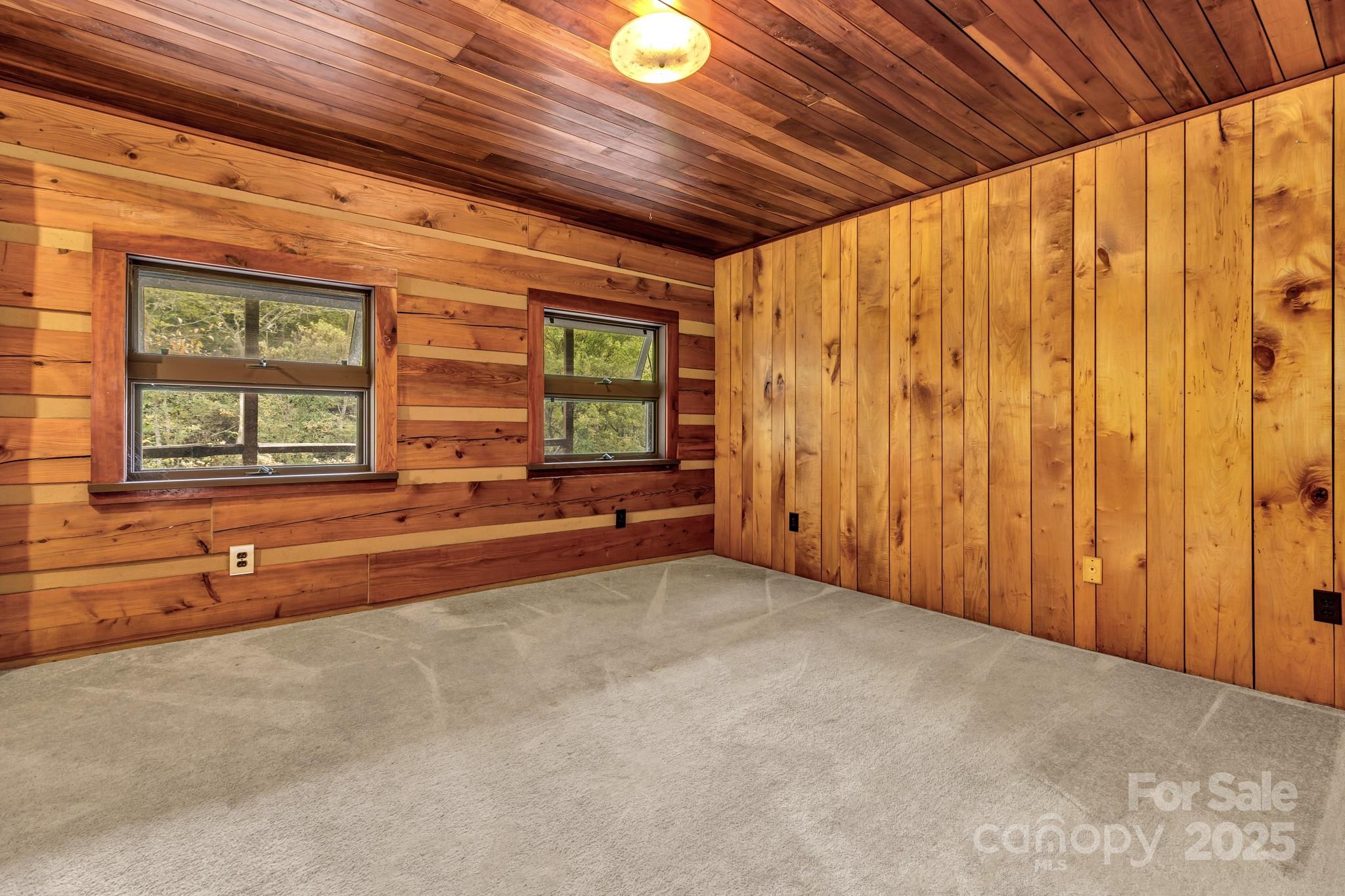 200 Dry Branch Road Marshall, NC 28753 - Photo 20 of 38 a view of a room with wooden walls and next to a window