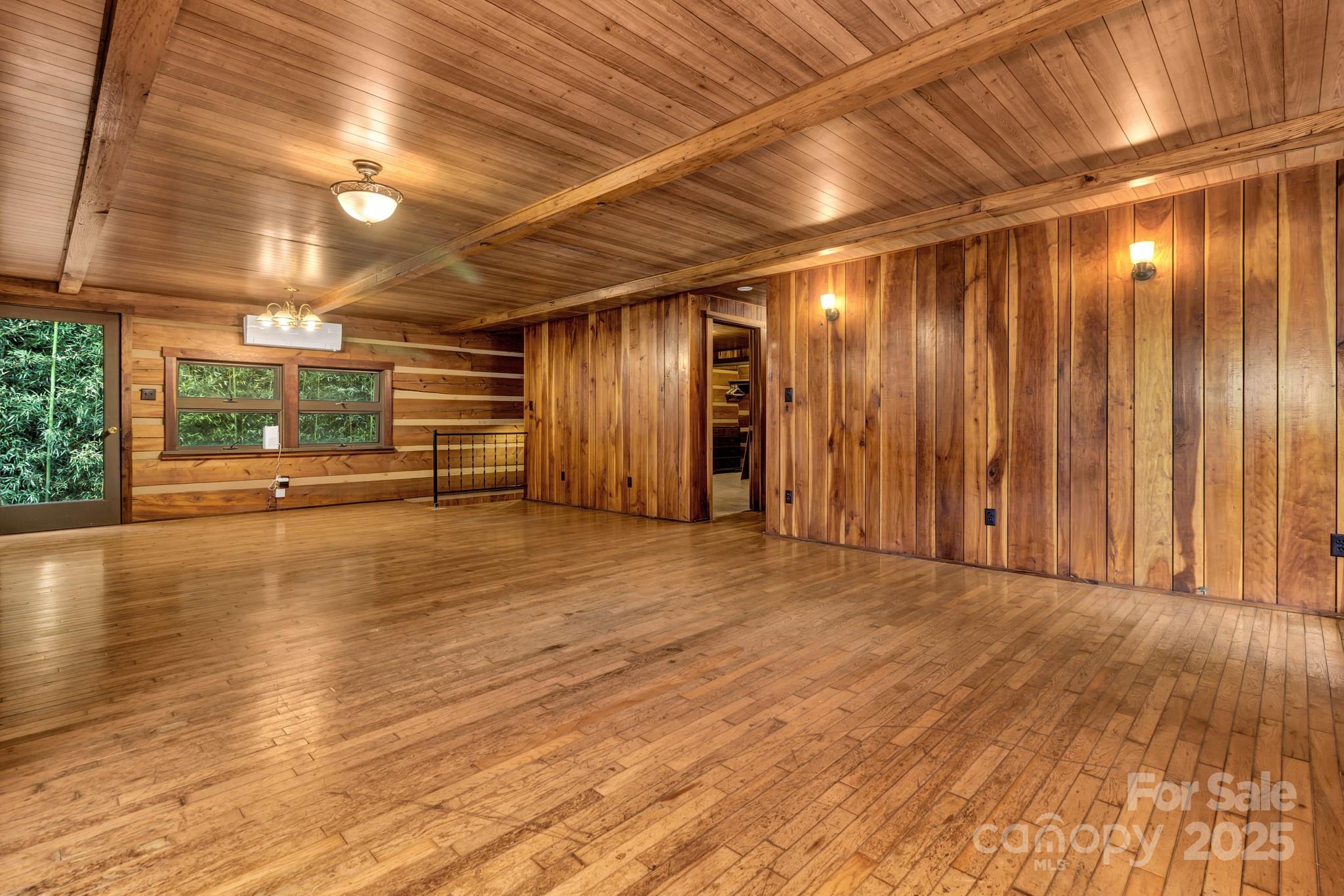 200 Dry Branch Road Marshall, NC 28753 - Photo 10 of 38 a view of an empty room with wooden floor