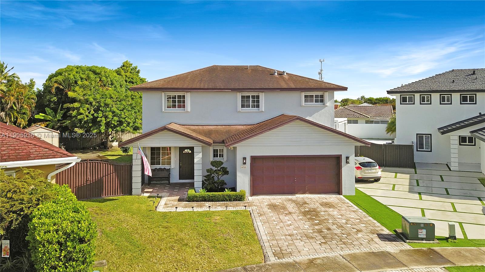 14723 Southwest 142nd Street Miami, FL 33196 - Photo 1 of 25 a front view of a house with garden