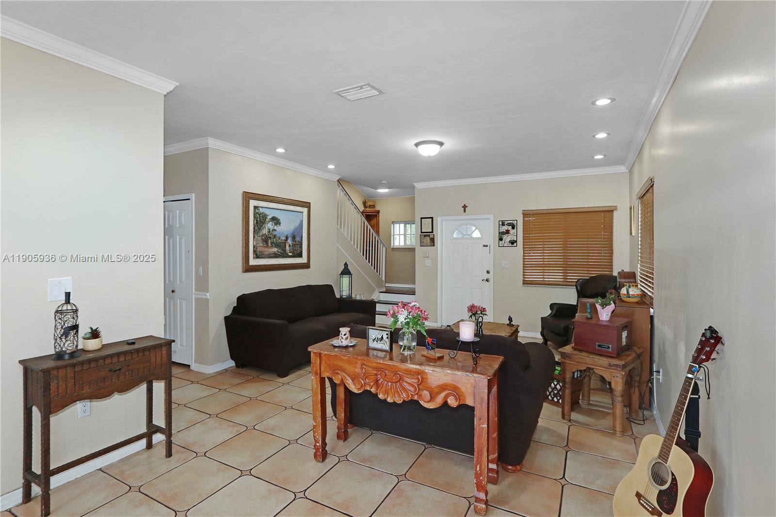14723 Southwest 142nd Street Miami, FL 33196 - Photo 12 of 25 a living room with furniture and a window
