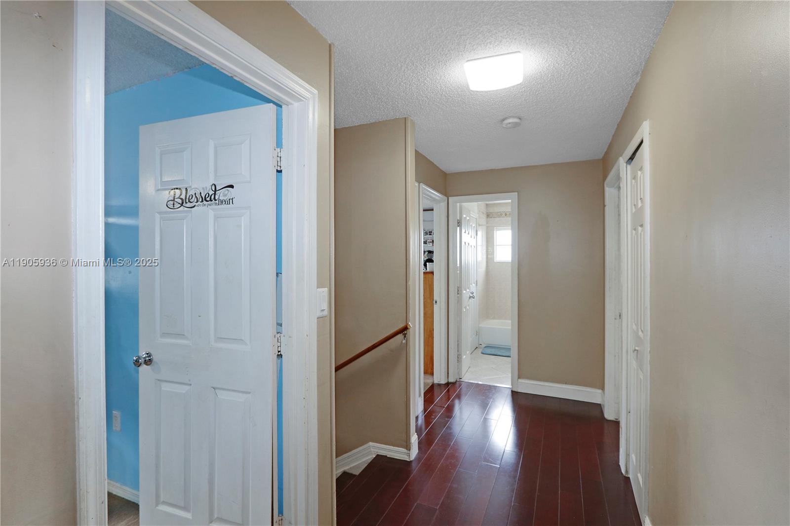 14723 Southwest 142nd Street Miami, FL 33196 - Photo 18 of 25 a view of a hallway with wooden floor