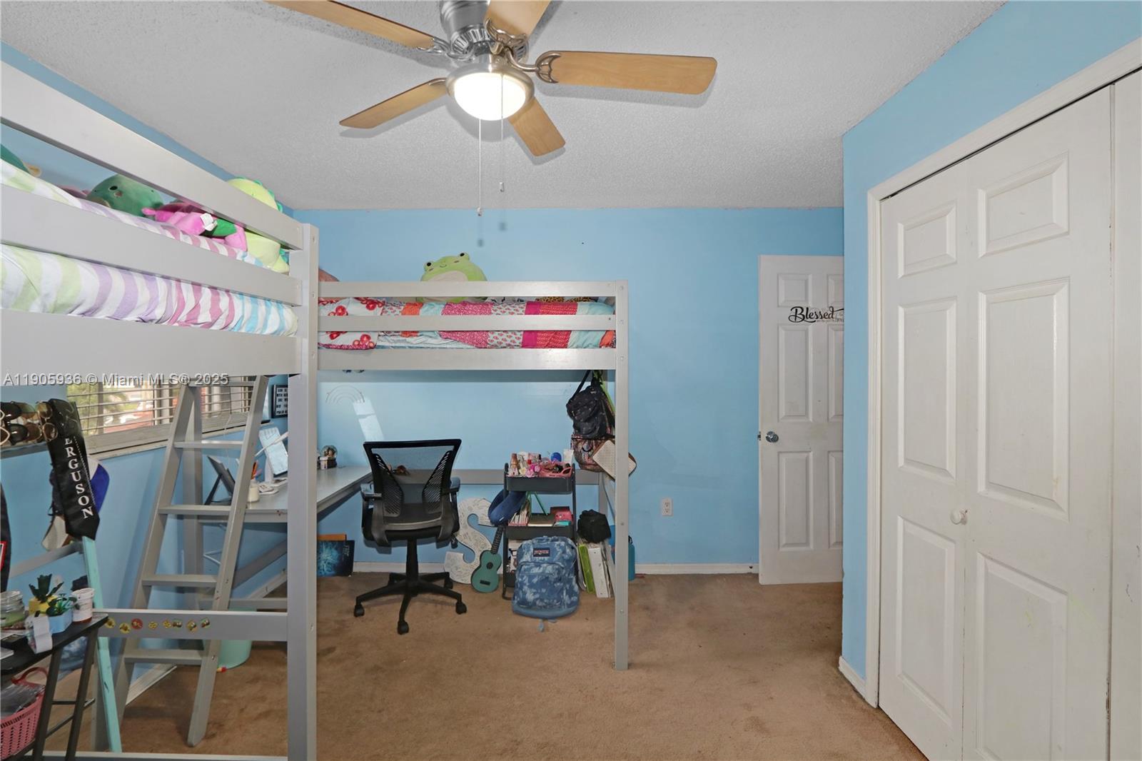 14723 Southwest 142nd Street Miami, FL 33196 - Photo 19 of 25 a view of a room with furniture and a chandelier