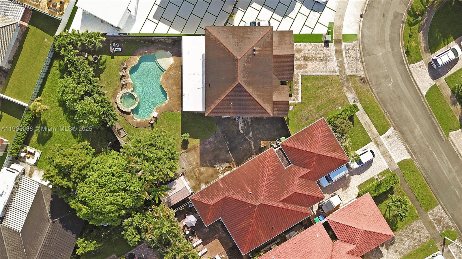 14723 Southwest 142nd Street Miami, FL 33196 - Photo 2 of 25 an aerial view of a house with swimming pool