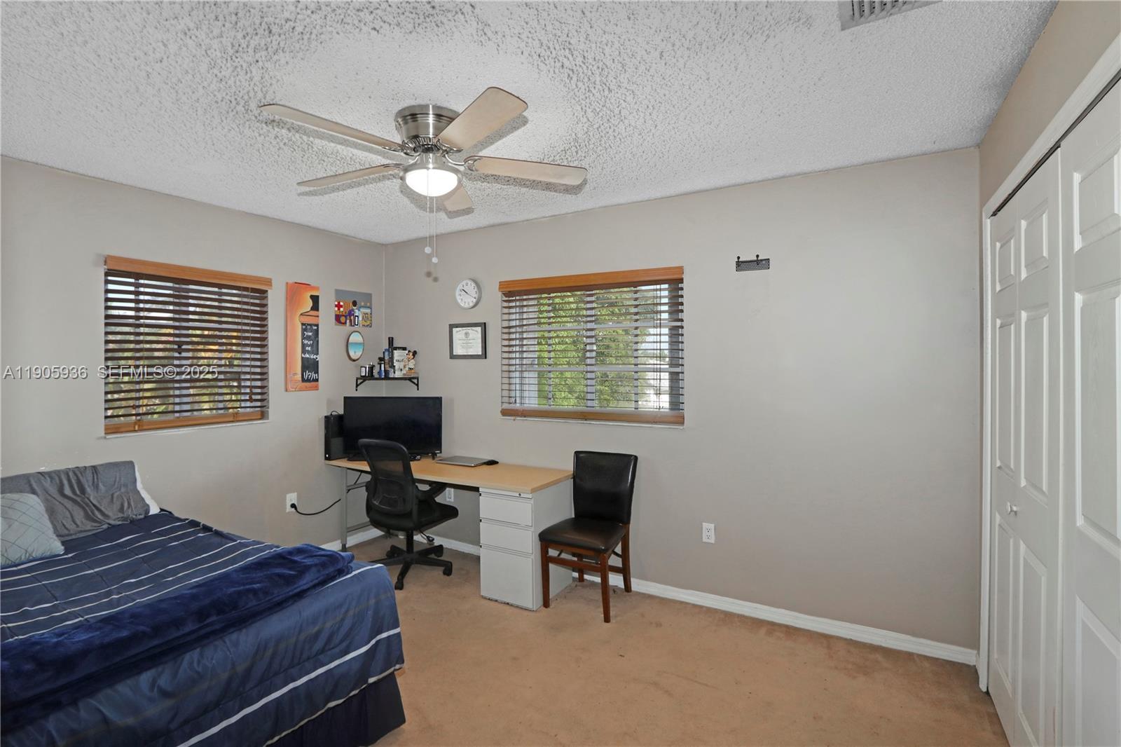 14723 Southwest 142nd Street Miami, FL 33196 - Photo 22 of 25 a living room with furniture and a window