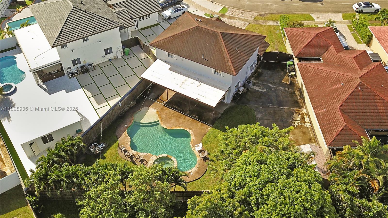 14723 Southwest 142nd Street Miami, FL 33196 - Photo 3 of 25 an aerial view of a house with a yard
