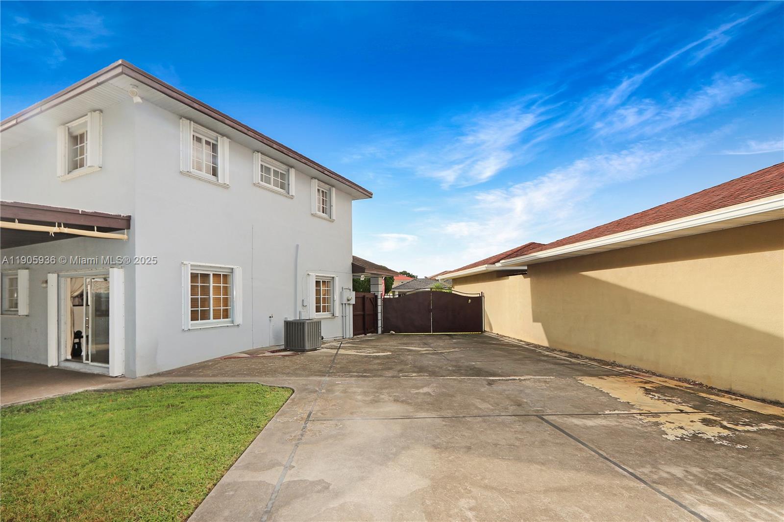 14723 Southwest 142nd Street Miami, FL 33196 - Photo 8 of 25 a view of a white house with a yard