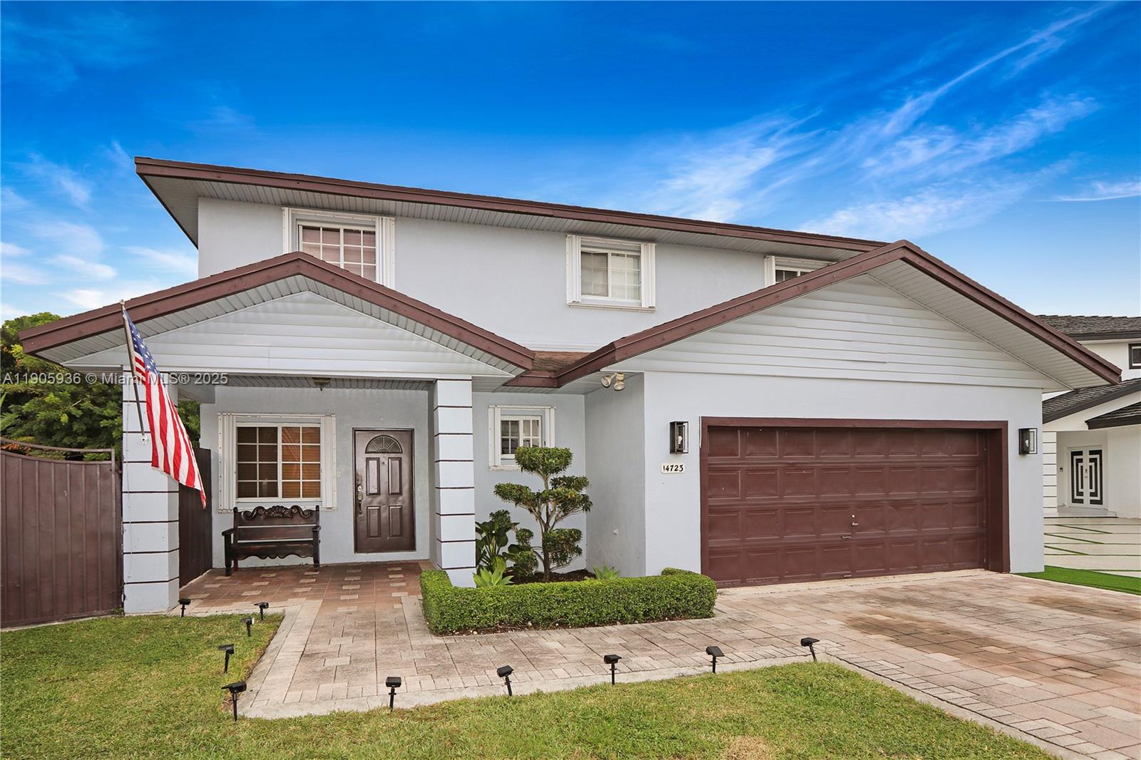 14723 Southwest 142nd Street Miami, FL 33196 - Photo 10 of 25 a front view of a house with a yard and garage