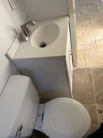 a bathroom with a sink and toilet