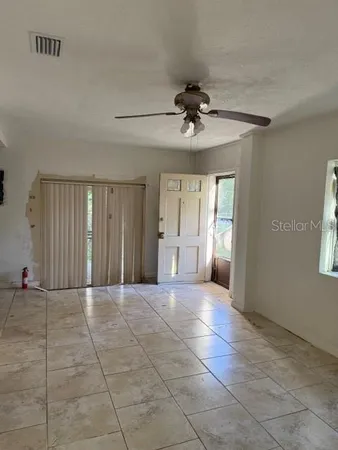 a view of an empty room with a window