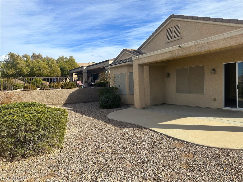 3034 Canal Walk Road Henderson, NV 89052 - Photo 19 of 24 This residence offers a tranquil outdoor retreat with a spacious covered patio and low-maintenance landscaping.