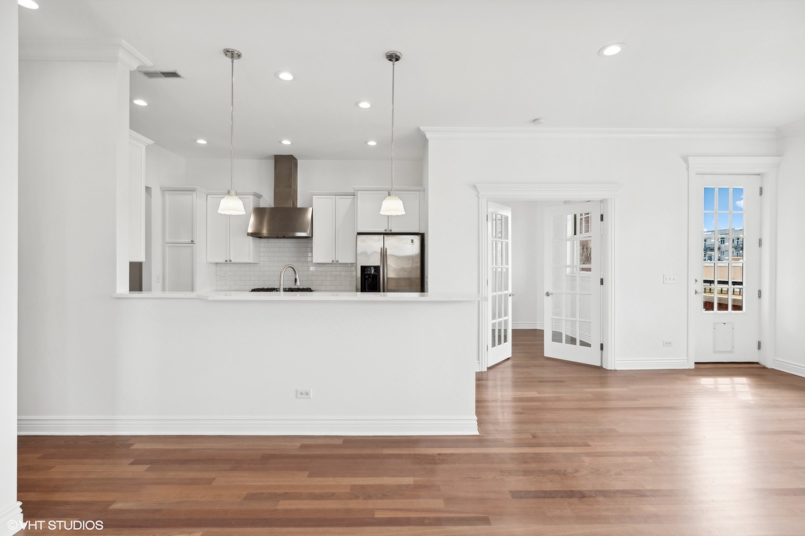 35 South Racine Avenue, Unit 4SW Chicago, IL 60607 - Photo 13 of 38 a view of kitchen with kitchen island and stainless steel appliances