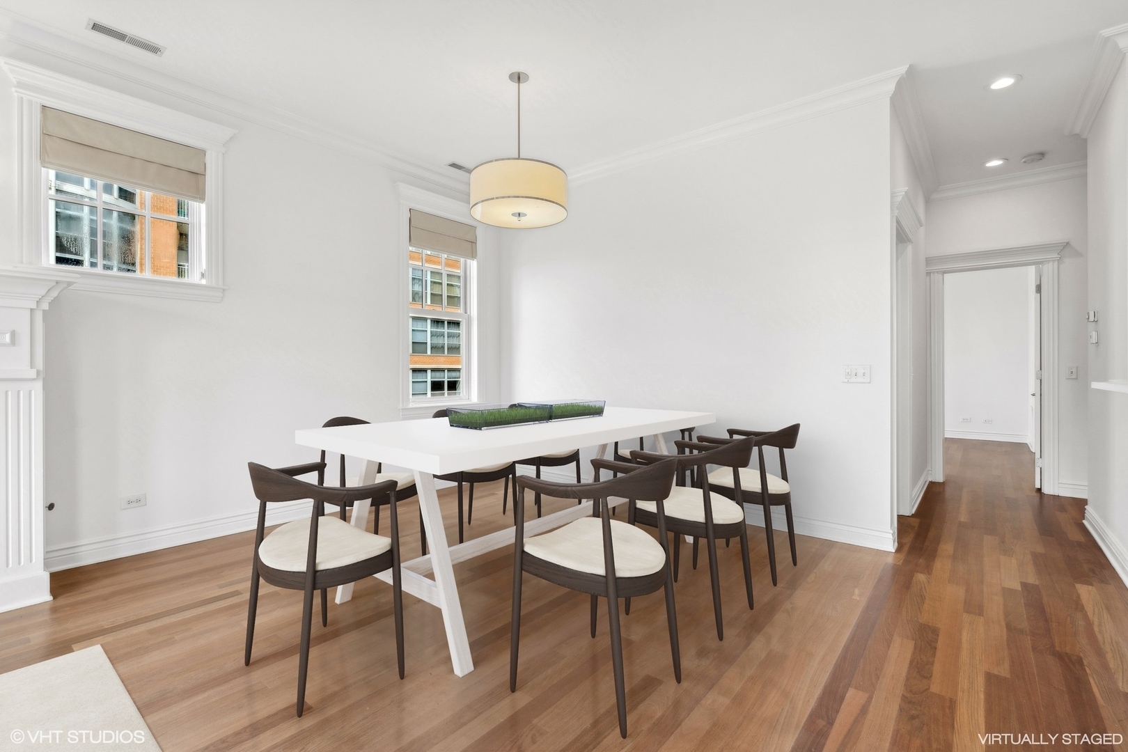 35 South Racine Avenue, Unit 4SW Chicago, IL 60607 - Photo 14 of 38 a view of a dining room with furniture wooden floor and chandelier