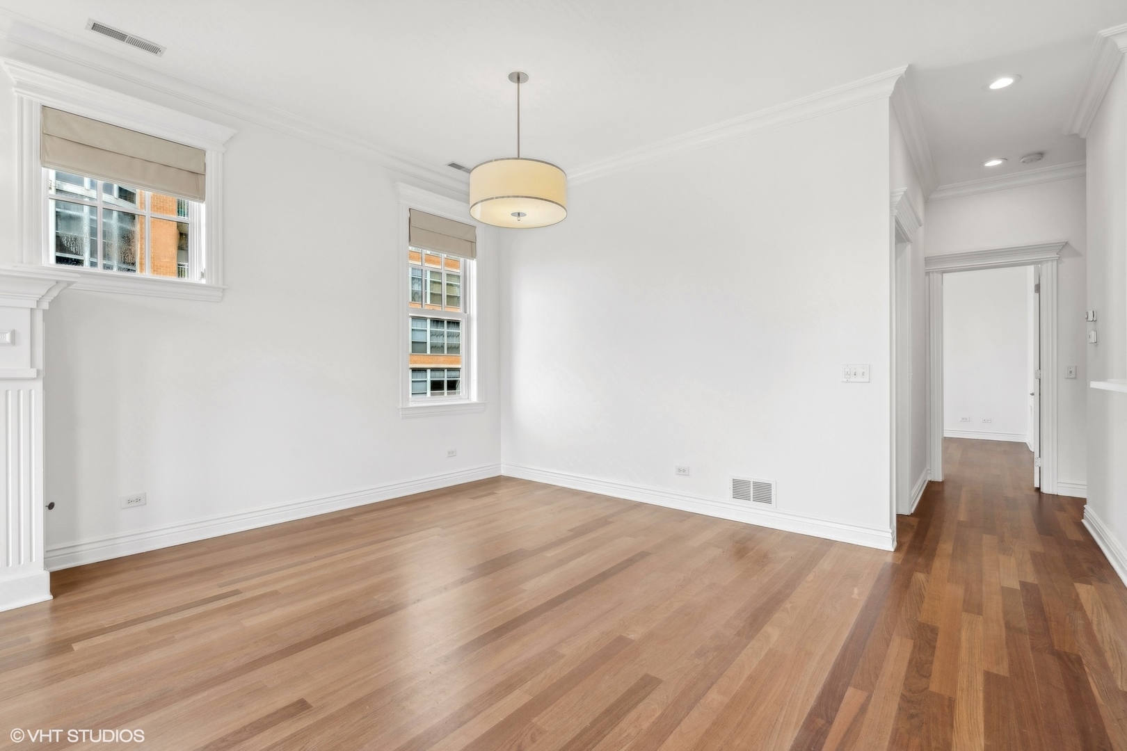 35 South Racine Avenue, Unit 4SW Chicago, IL 60607 - Photo 15 of 38 an empty room with wooden floor and windows