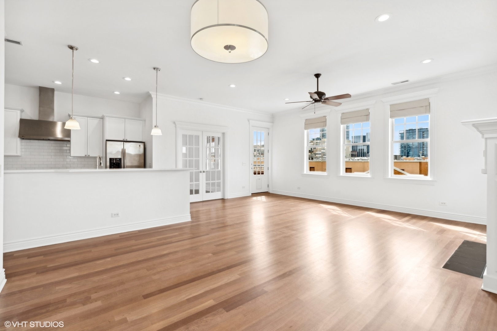 35 South Racine Avenue, Unit 4SW Chicago, IL 60607 - Photo 17 of 38 an open kitchen with wooden floor and windows