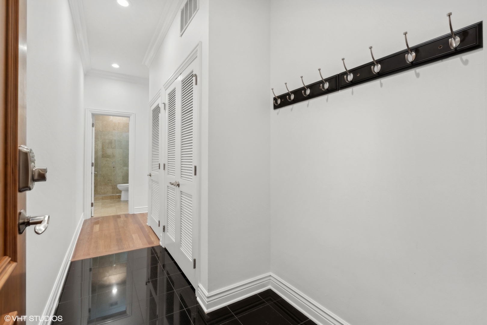 35 South Racine Avenue, Unit 4SW Chicago, IL 60607 - Photo 2 of 38 a view of a hallway with wooden floor