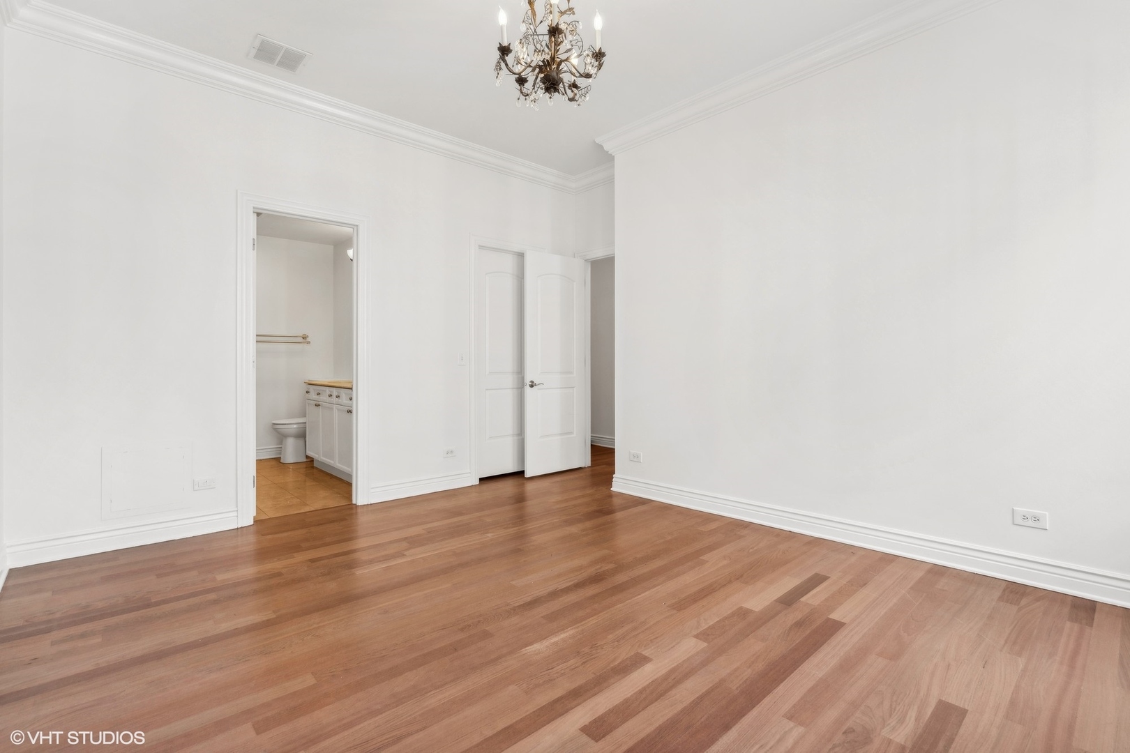 35 South Racine Avenue, Unit 4SW Chicago, IL 60607 - Photo 25 of 38 a view of an empty room with wooden floor