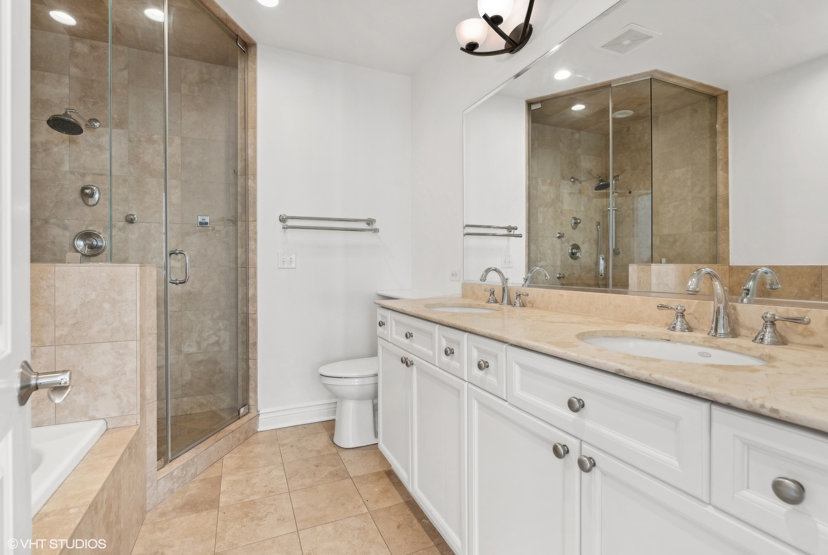 35 South Racine Avenue, Unit 4SW Chicago, IL 60607 - Photo 26 of 38 a bathroom with a granite countertop sink a toilet and shower