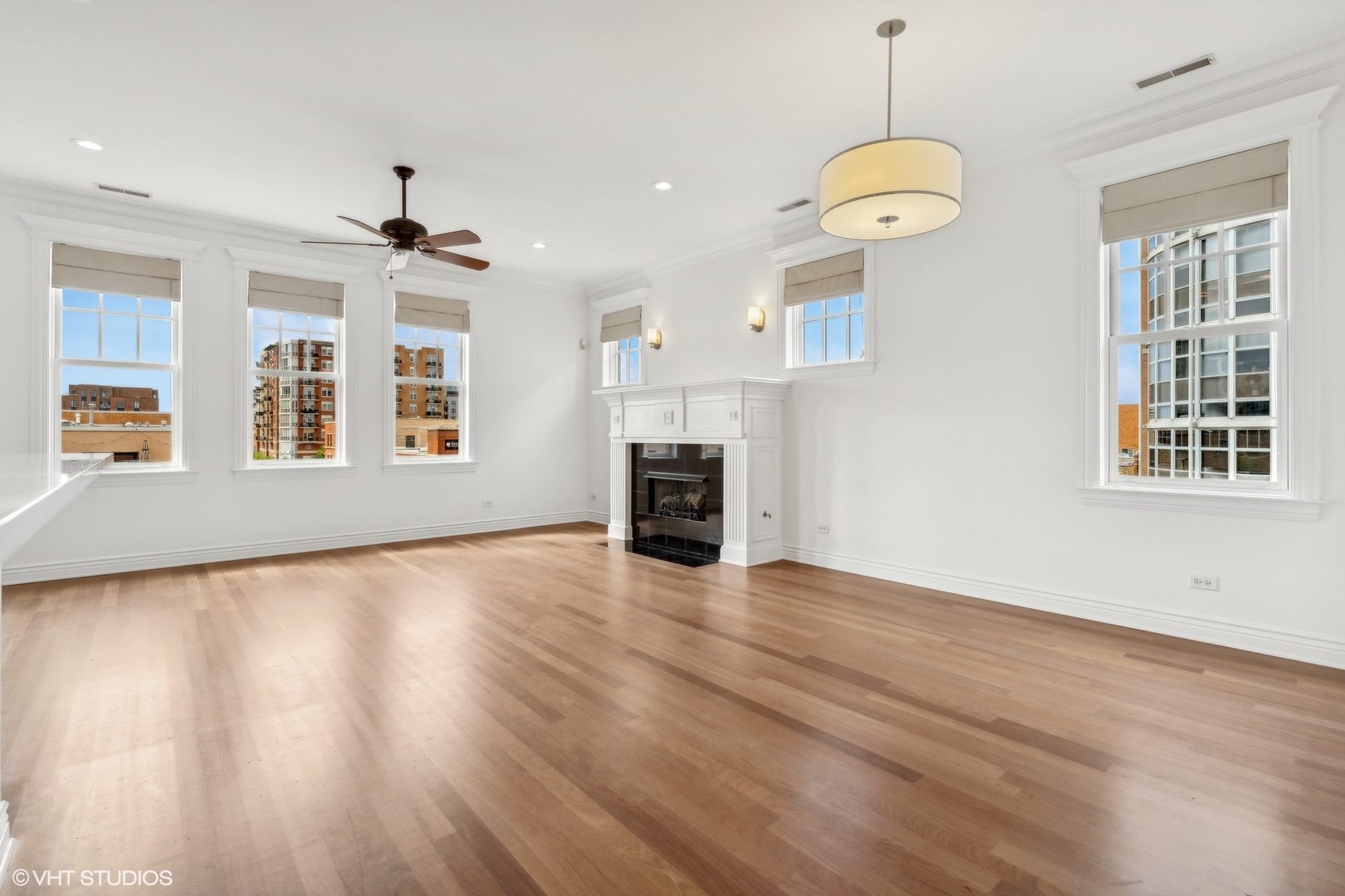 35 South Racine Avenue, Unit 4SW Chicago, IL 60607 - Photo 6 of 38 an empty room with wooden floor and windows