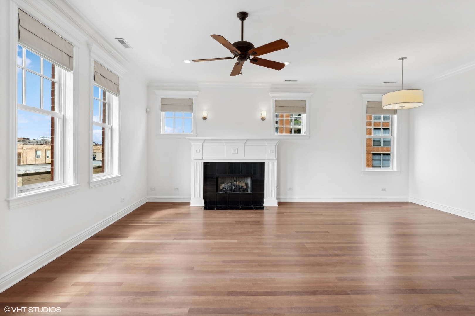35 South Racine Avenue, Unit 4SW Chicago, IL 60607 - Photo 8 of 38 a view of empty room with wooden floor and a ceiling fan