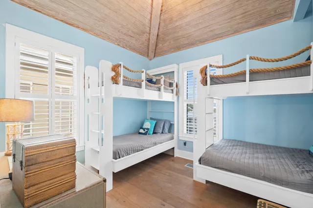 a bedroom with furniture and a window