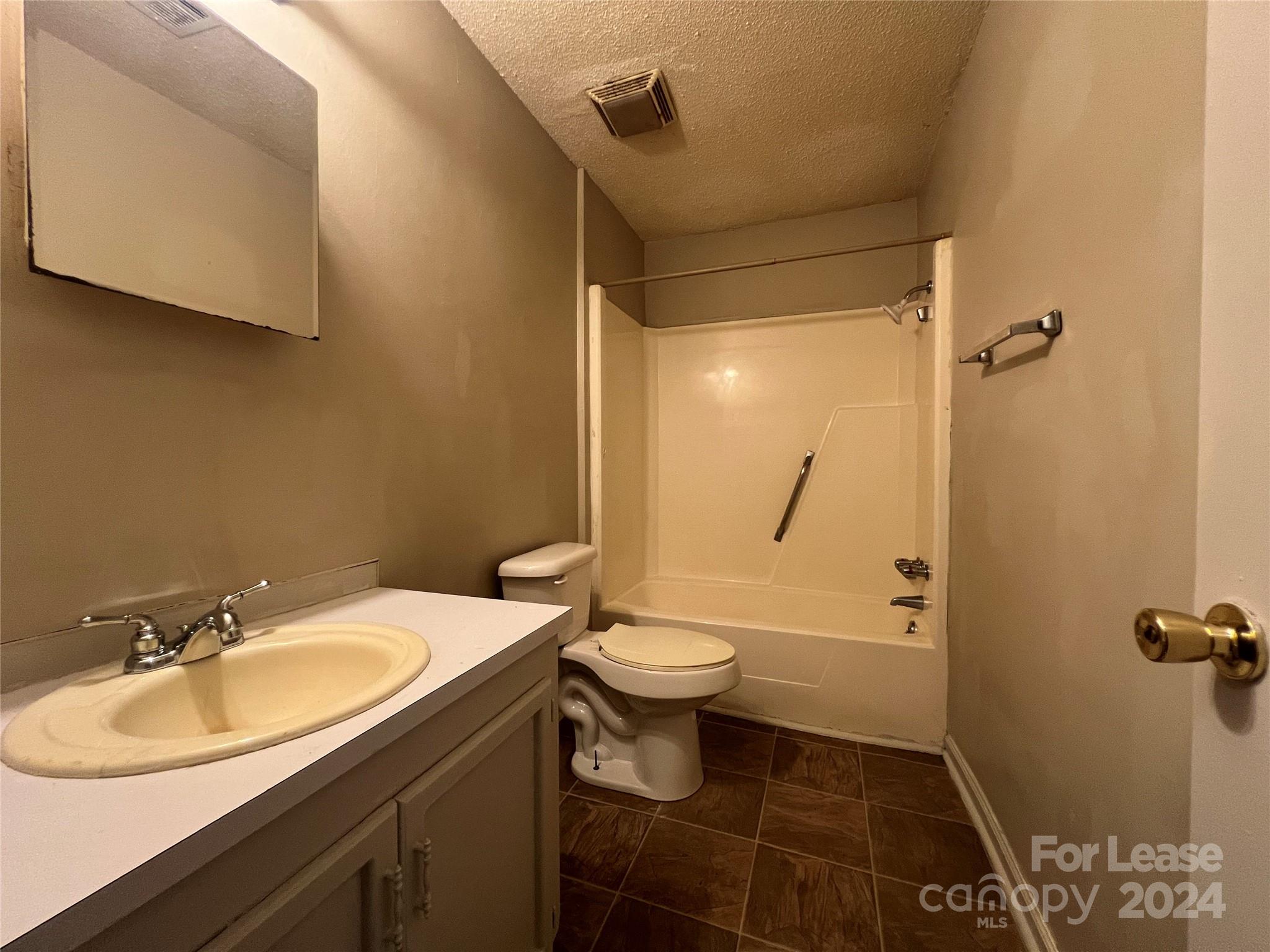 113 Drake Street, Unit A Gastonia, NC 28052 - Photo 7 of 8 a bathroom with a sink toilet and shower