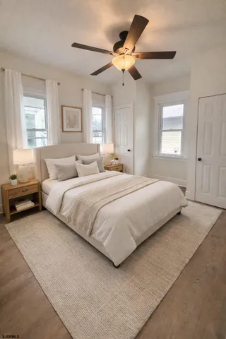 a bedroom with bed and window