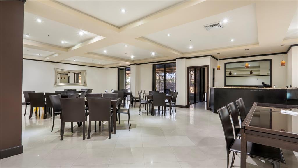 8877 Collins Avenue, Unit 1107 Surfside, FL 33154 - Photo 35 of 42 a view of a dining room with furniture