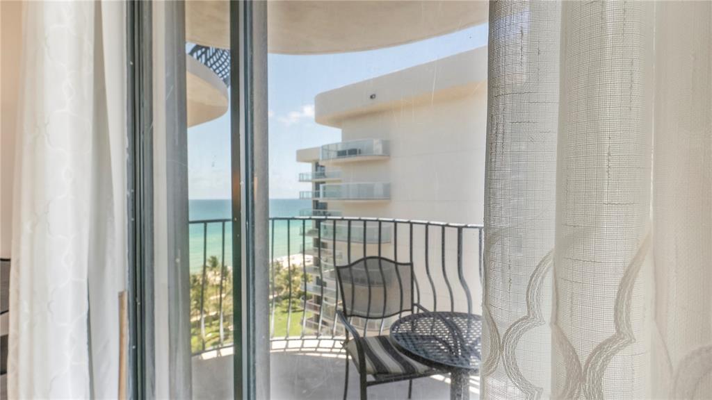 8877 Collins Avenue, Unit 1107 Surfside, FL 33154 - Photo 4 of 42 a view of entryway with wooden floor