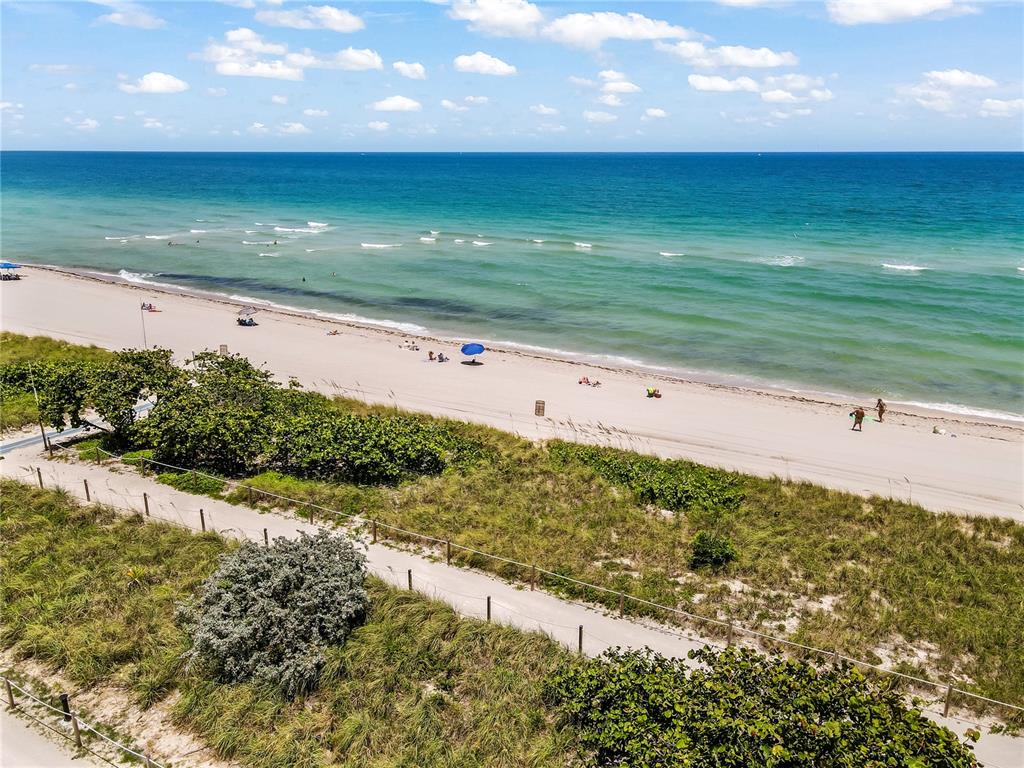 8877 Collins Avenue, Unit 1107 Surfside, FL 33154 - Photo 9 of 42 a view of an ocean beach