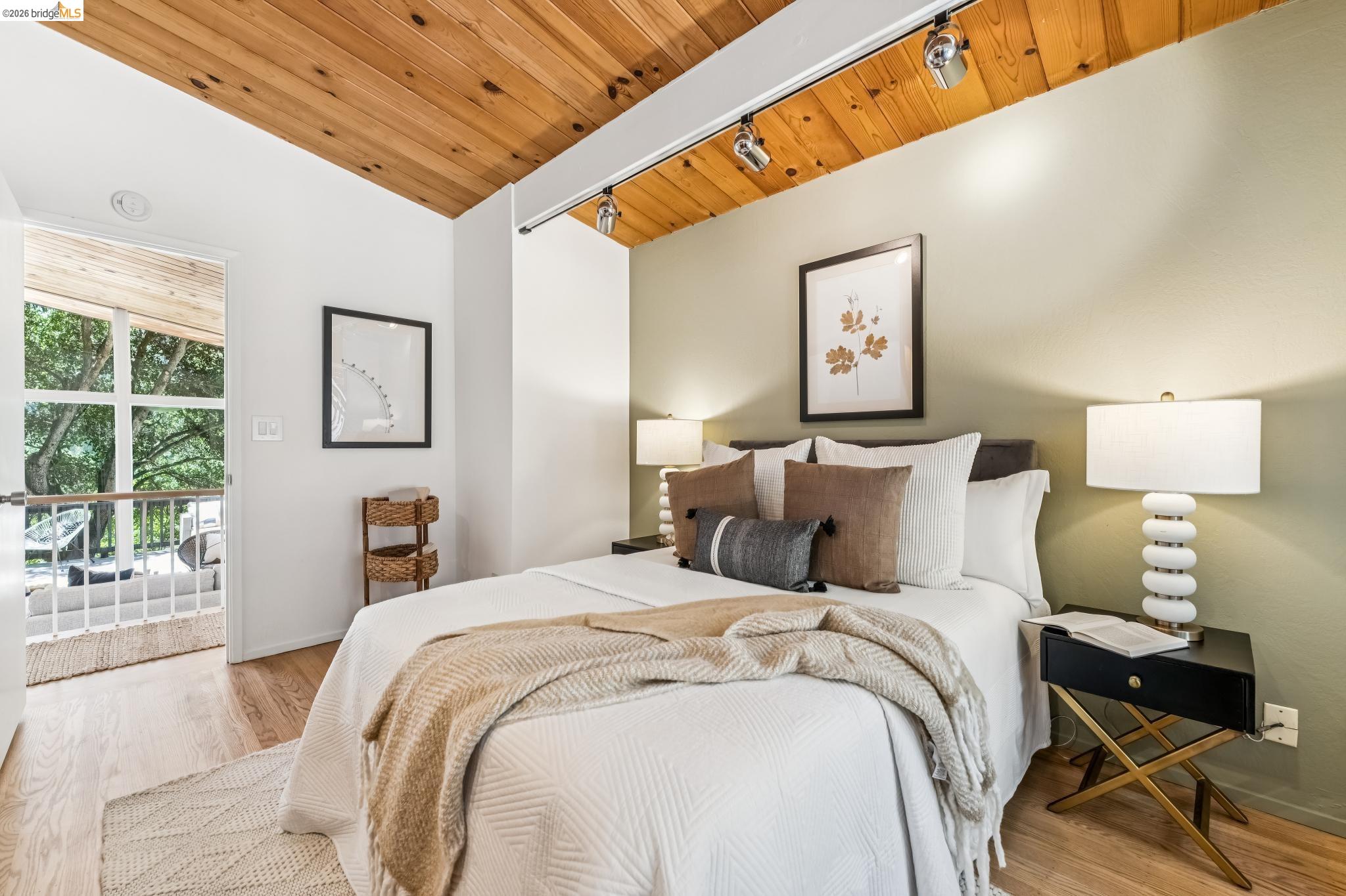 6645 Heather Ridge Way Oakland, CA 94611 - Photo 30 of 61 Vaulted wood-finish ceiling with track lighting