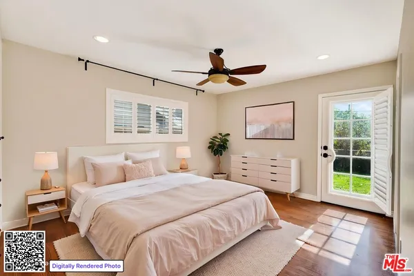 a bedroom with a large bed and a window