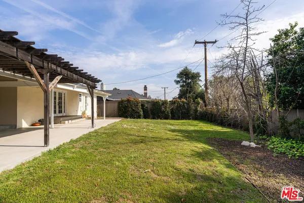a house view with a backyard space