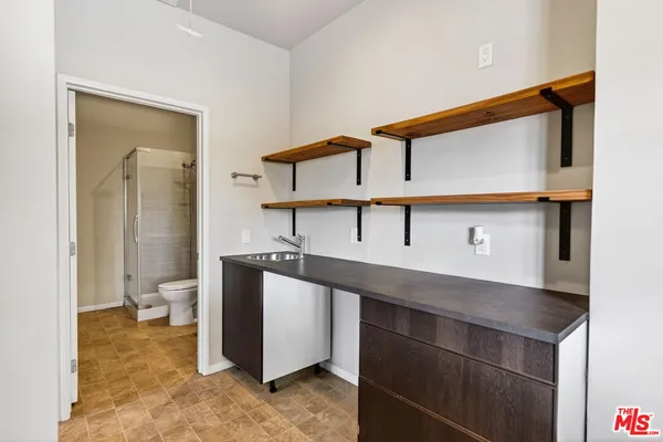 a view of bathroom with a sink and a toilet