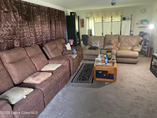 a living room with furniture and a couch