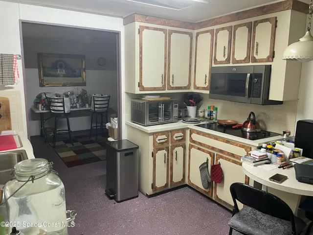 a kitchen that has a sink and a stove