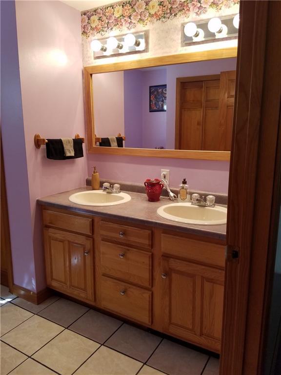 327 Sennett Road Jefferson, ME 04348 - Photo 25 of 32 1ST FLOOR POWDER ROOM HAS DOUBLE VANITY