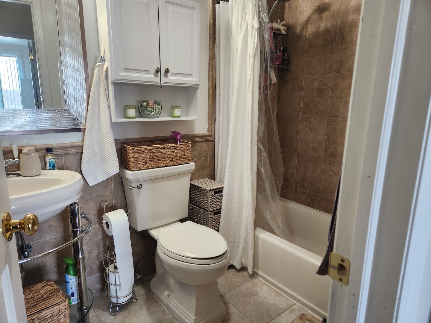 1 Renaissance Place, Unit 816 Palatine, IL 60067 - Photo 12 of 17 a white toilet sitting next to a bathroom sink