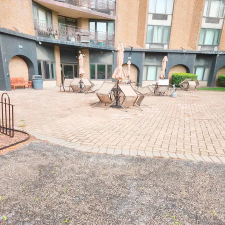 a view of a swimming pool with a lounge chairs