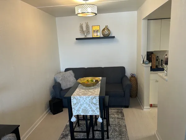 a living room with furniture and a table