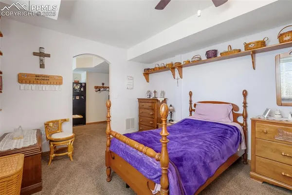 a bedroom with bed and window